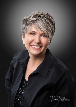 Professional headshot of woman small business owner demonstrating retouching
